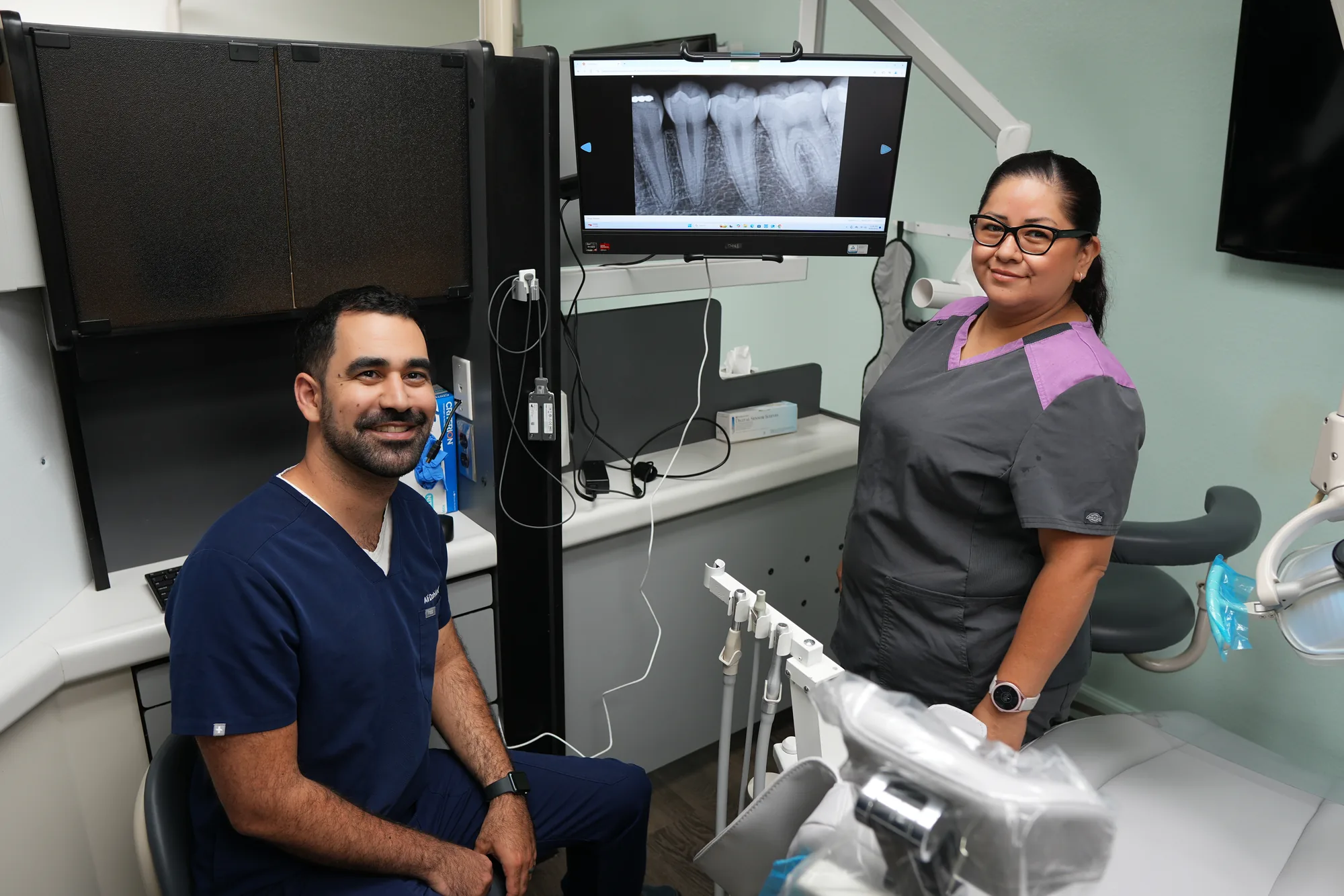 Dr. Dabirian with a team member in the treatment room