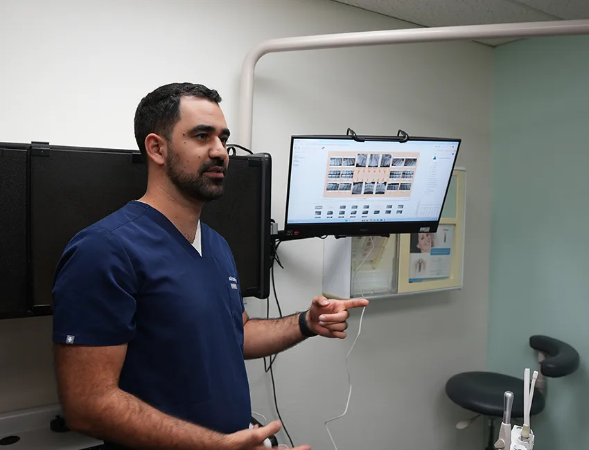 Dr. Dabirian reviewing digital X-rays on the monitor in the treatment room